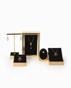 Conjuntos de exhibición de escaparate de joyería de acero inoxidable de oro de terciopelo negro de lujo para la venta