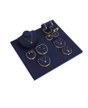 Espositori di lusso per gioielli in metallo dorato in velluto blu navy in vendita