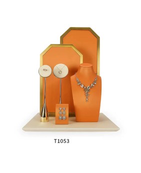 Conjunto de exhibición de joyería de cuero naranja de metal dorado de lujo