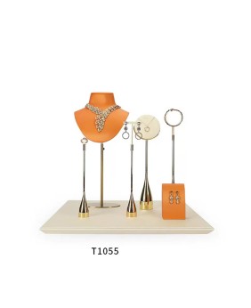 Conjunto de exhibición de joyería de cuero naranja de metal dorado al por menor